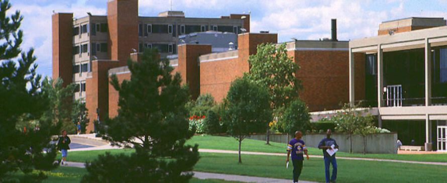 Students walking in front of campus